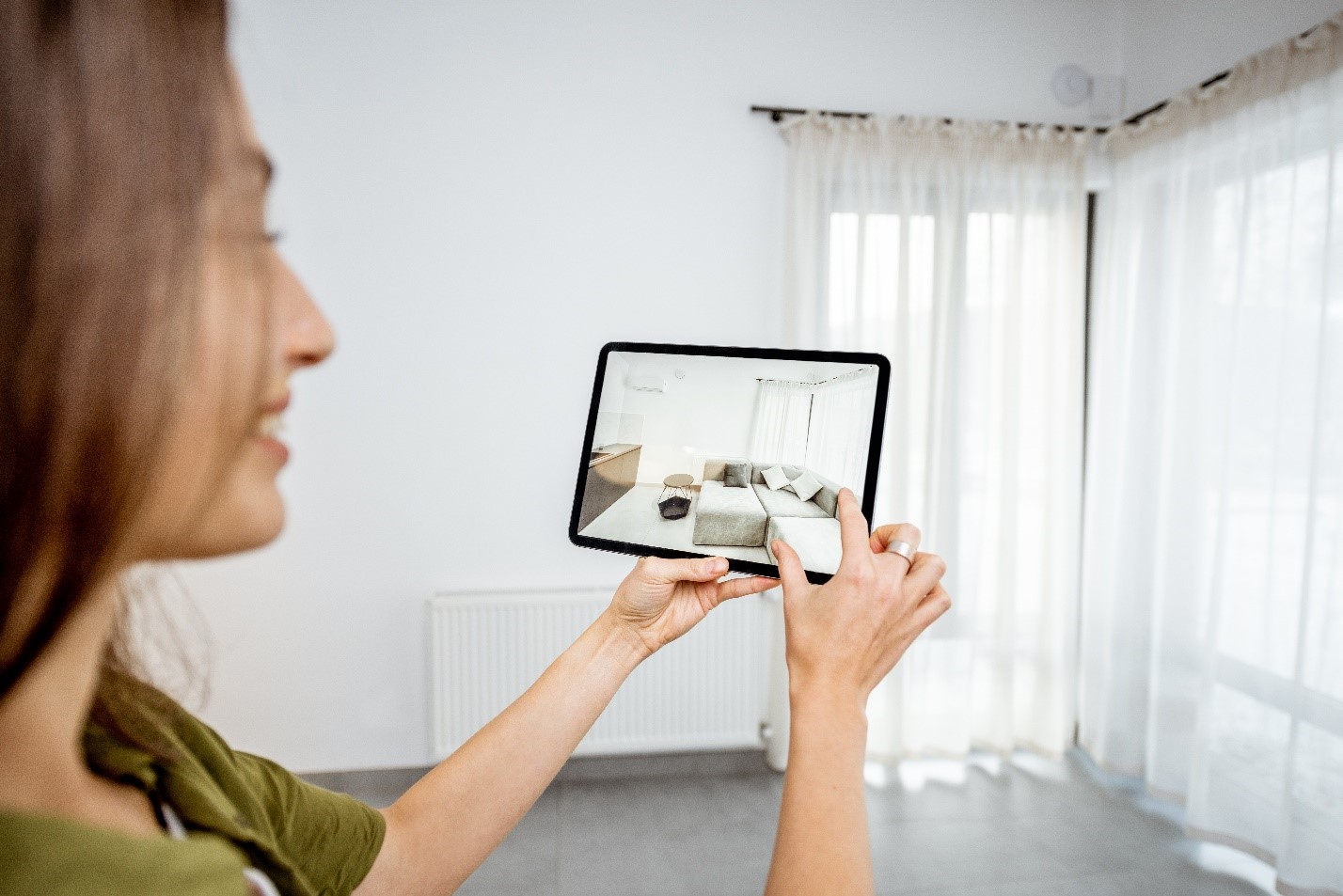 A Women Checking A Property On Her Tablet